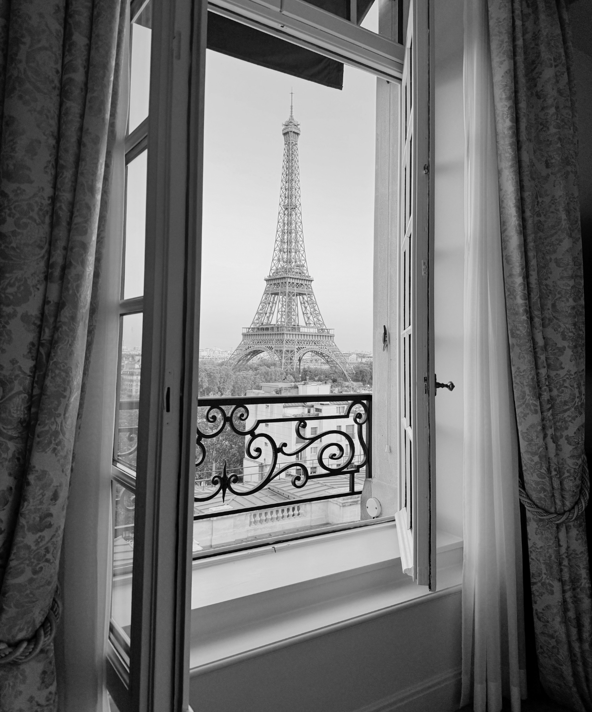 View of the Eiffel Tower from an open window of a suite at the Shangri-La Paris