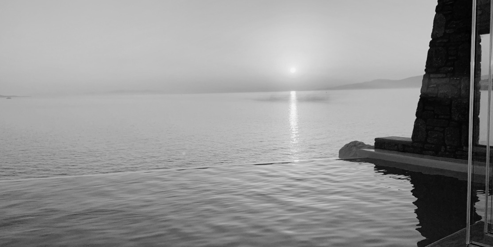 Sunset from the infinity pool at Cavo Tagoo, Mykonos, 2019